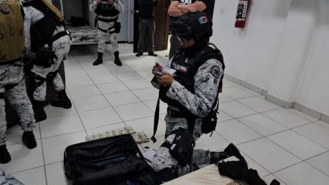 Hallan en cuartel de la Guardia Nacional 48 mil dólares y armas sin registrar